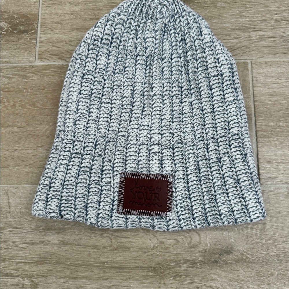 Love Your Melon Marled Gray and White Knit Beanie with Brown Patch